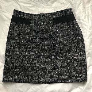 Forenza skirt. Side zip.  Fixed buttons in front with ribbon like accent.